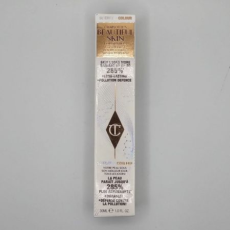Charlotte Tilbury Beautiful Skin Foundation 7 Neutral 1 oz bottle displayed with product packaging