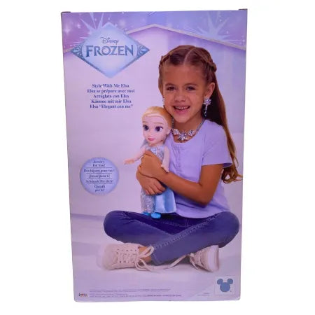 Disney Frozen Elsa doll with blue dress and child jewelry accessories in damaged box packaging